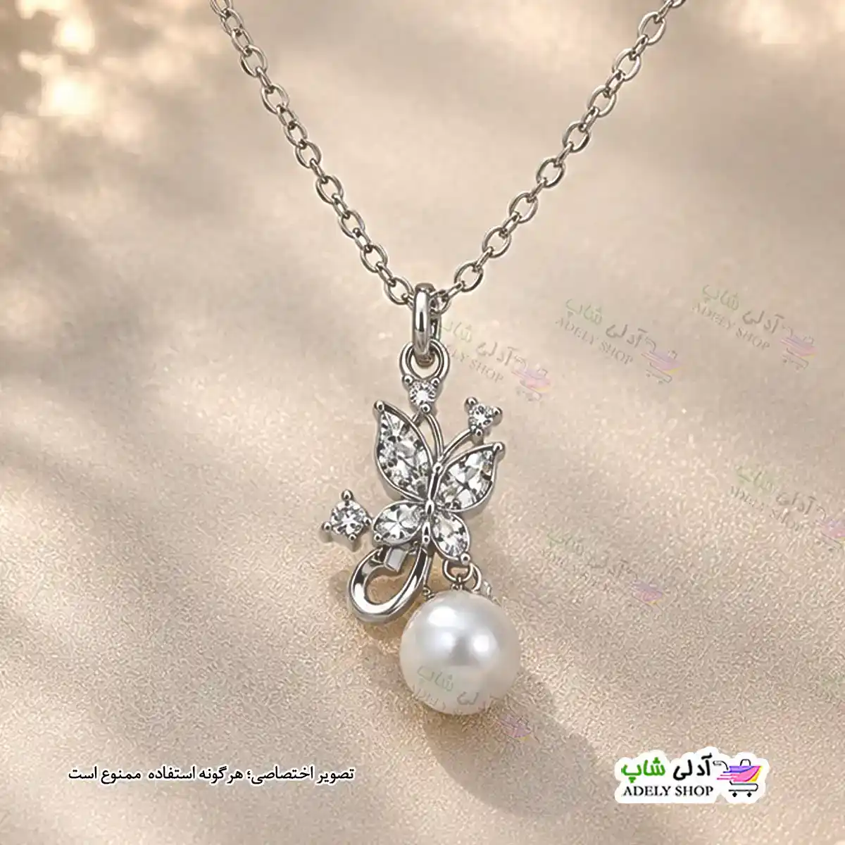 تصویر گردنبند طرح پروانه و مروارید