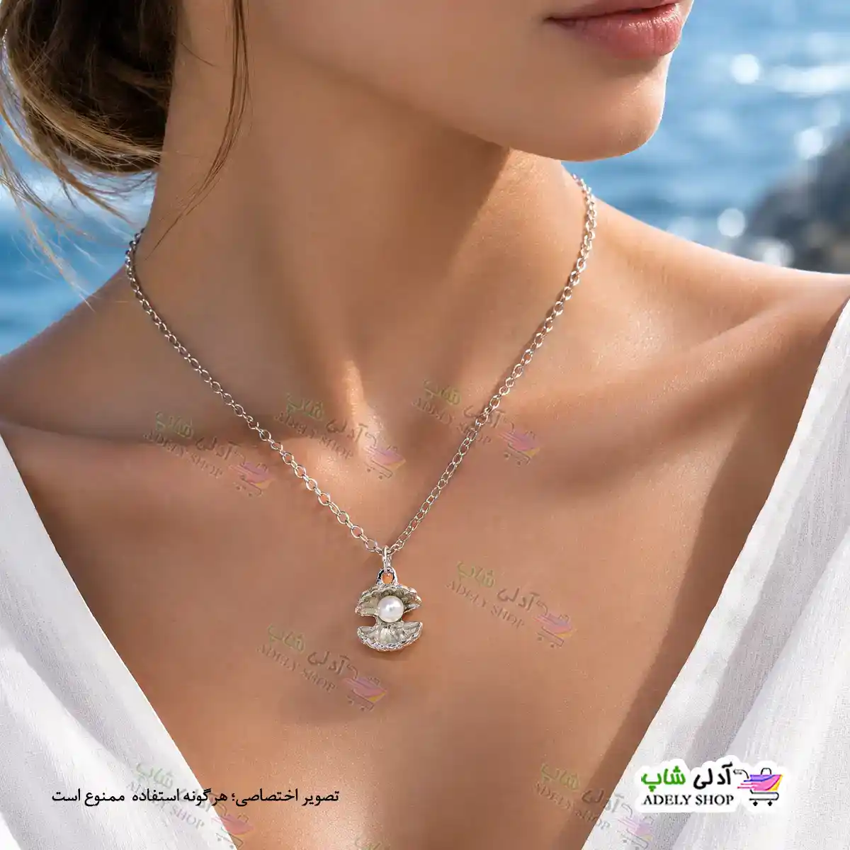 تصویر گردنبند طرح صدف و مروارید